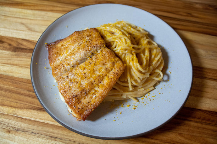 Spaghetti al limone with pan-seared kanpachi and grated bottarga