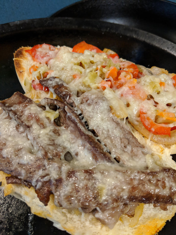 Seared Ribeye, Sauted Onions And Peppers, Hot Giardiniera, And Melted Swiss On A Toasted Roll