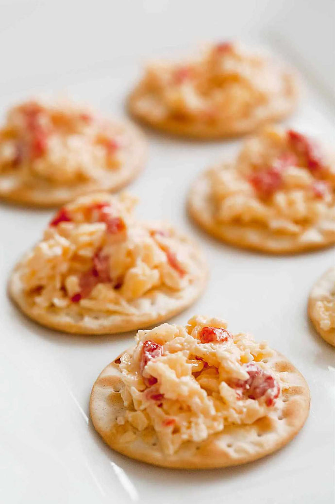 This pimento cheese is a Southern classic made from Cheddar cheese, pimentos, sweet onion, and mayonnaise.