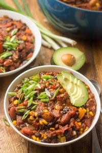 Packed with veggies, spices, and beans, this hearty vegan chili will knock your socks off! Easy to make in the stove or Instant Pot, and perfect for feeding a crowd.