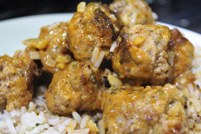 Lemony, veal meatballs served with cranberry, lemon rice.