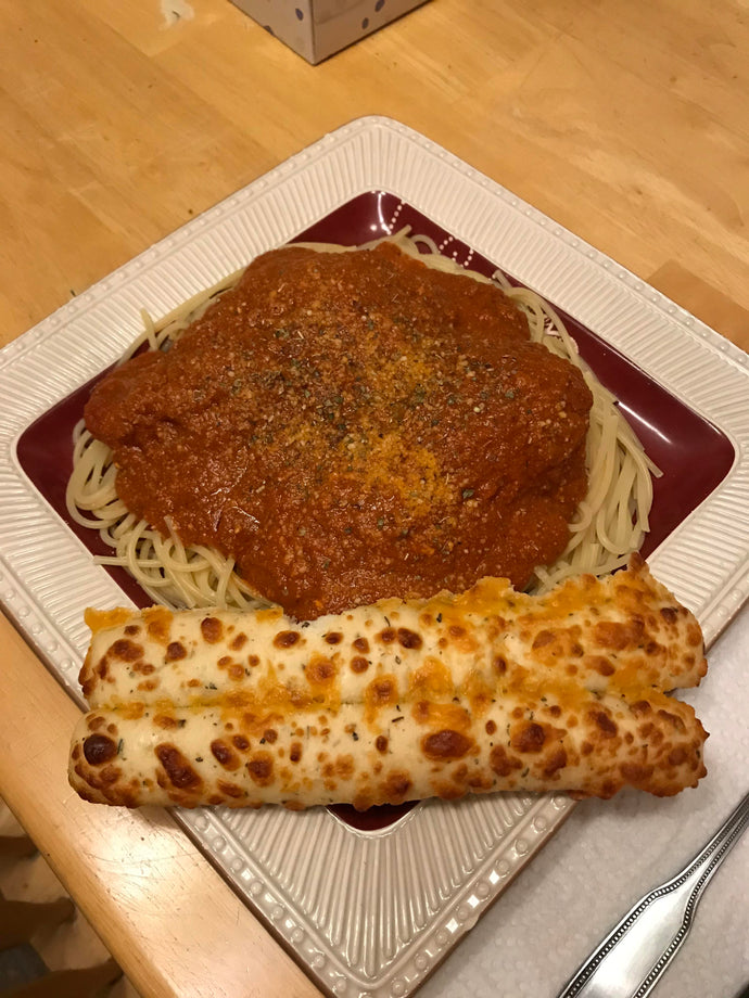 Theres two chicken breasts under the sauce but I am not sure what to call it.