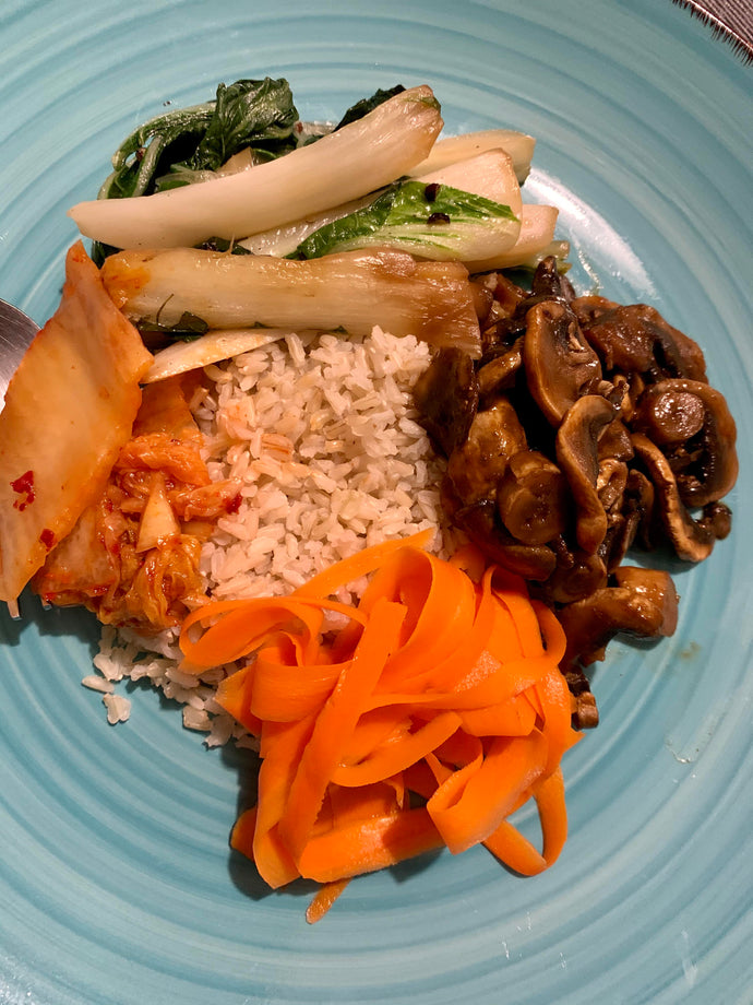 A clean the fridge out kinda meal. Stir fried bok choy, gochujang glazed mushrooms, rice and some kimchi to spice it about.