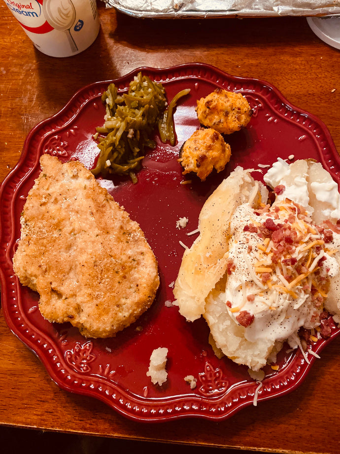 Baked breaded chicken, green beans, baked potatoes and stuffed mushrooms