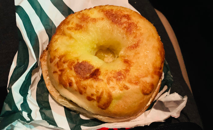 18 hour drive finally in New York Asiago Bagel with globs of butter