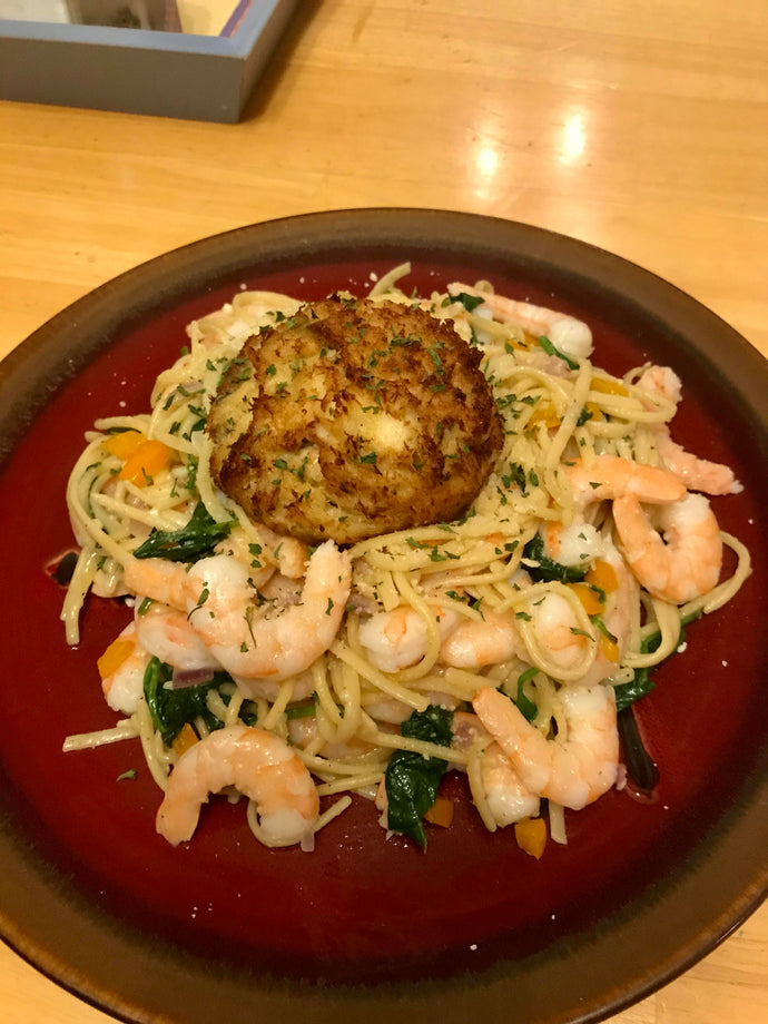 Some shrimp pasta and a lump crab cake.