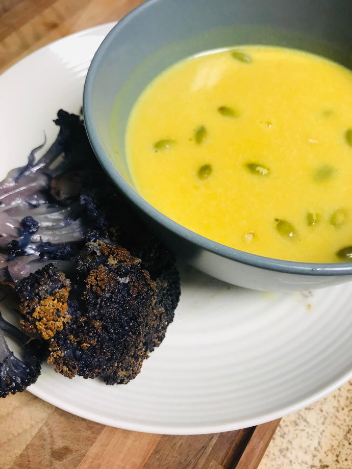 Roasted purple cauliflower and curried butternut squash soup with pepitas