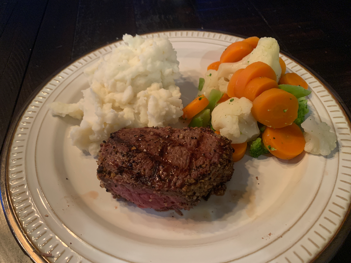 Grilled steak, steamed vegetables, and mashed potatoes